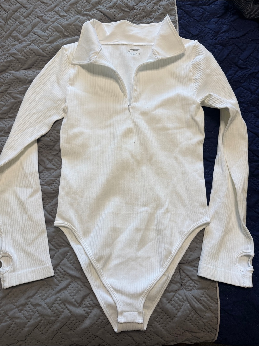 OQQ Woman’s White Ribbed Half-Zip One-Piece Bodysuit